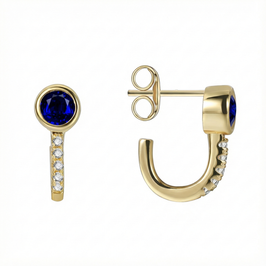 Boucles d’oreilles demi-créoles doré à l’or 18k avec zircon bleu