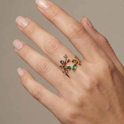Bague en acier inoxydable couleur doré avec design branches et cristaux multicolores