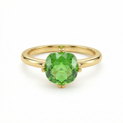 Bague dorée en acier inoxydable avec pierre verte facettée sertie à quatre griffes