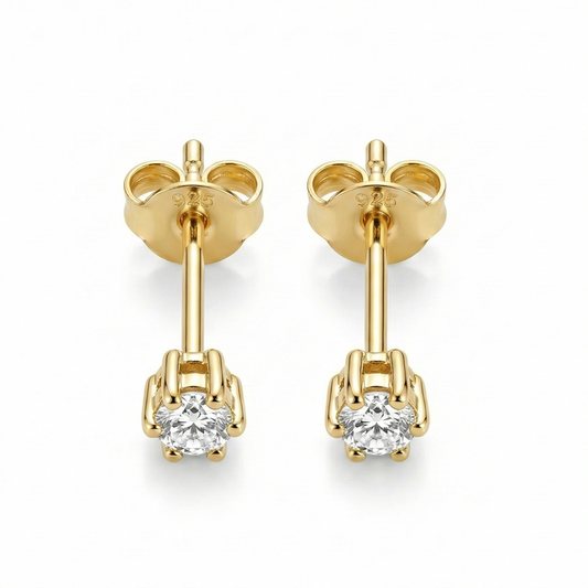 Boucles d'oreilles puces effet diamant solitaire : pierre zircon transparente brillante sur argent 925 doré à l'or fin.