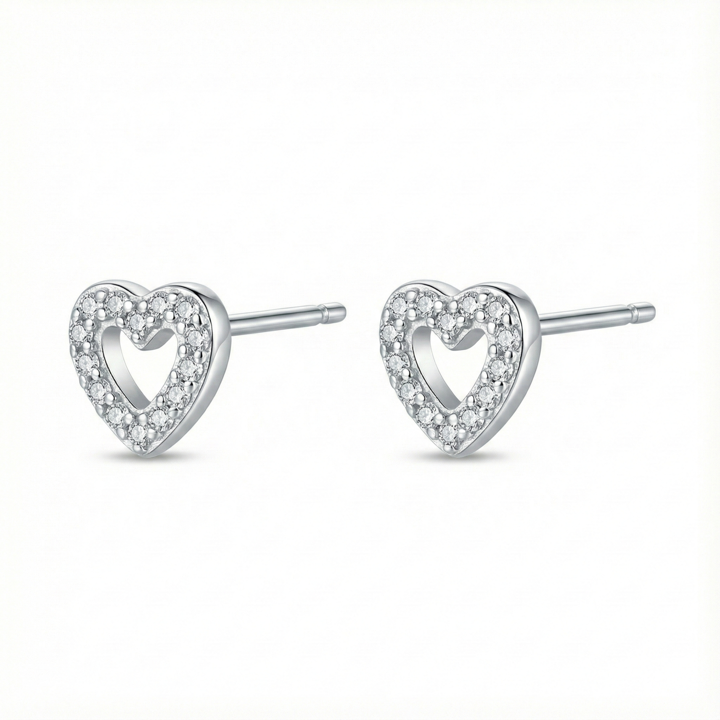 Bijou hypoallergénique pour oreilles sensibles : puces cœur en argent fin 999 (pur) serties de zircons brillants.