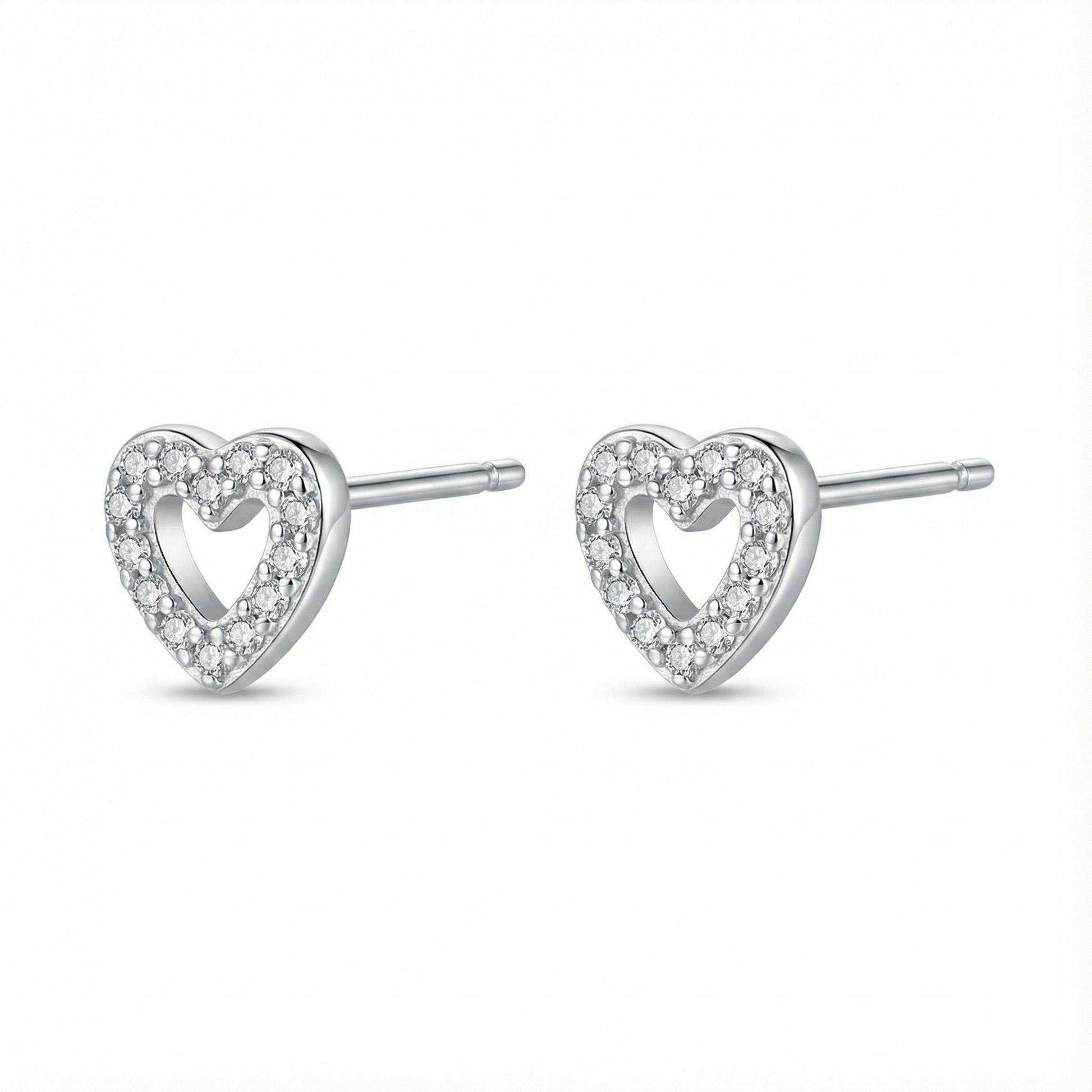 Bijou hypoallergénique pour oreilles sensibles : puces cœur en argent fin 999 (pur) serties de zircons brillants.