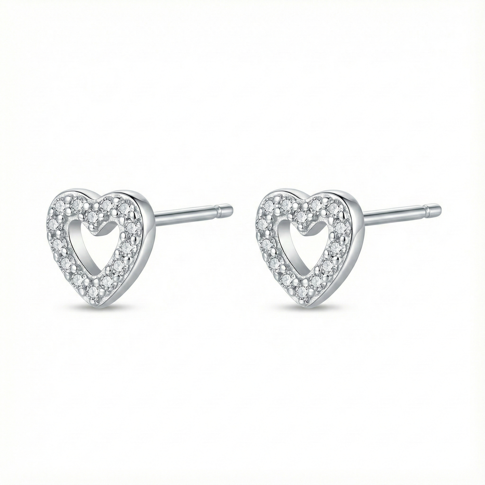 Bijou hypoallergénique pour oreilles sensibles : puces cœur en argent fin 999 (pur) serties de zircons brillants.