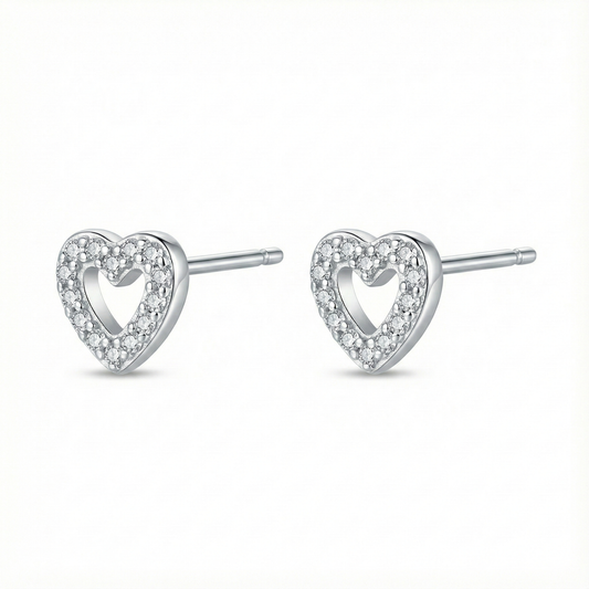 Bijou hypoallergénique pour oreilles sensibles : puces cœur en argent fin 999 (pur) serties de zircons brillants.