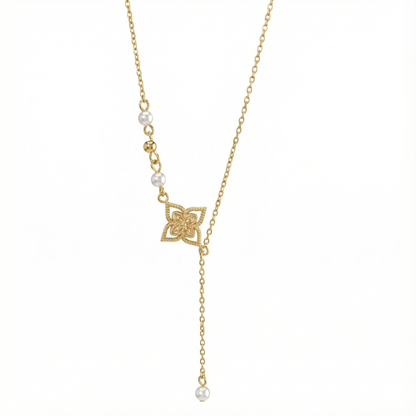 Collier doré asymétrique avec pendentif fleur et perles
